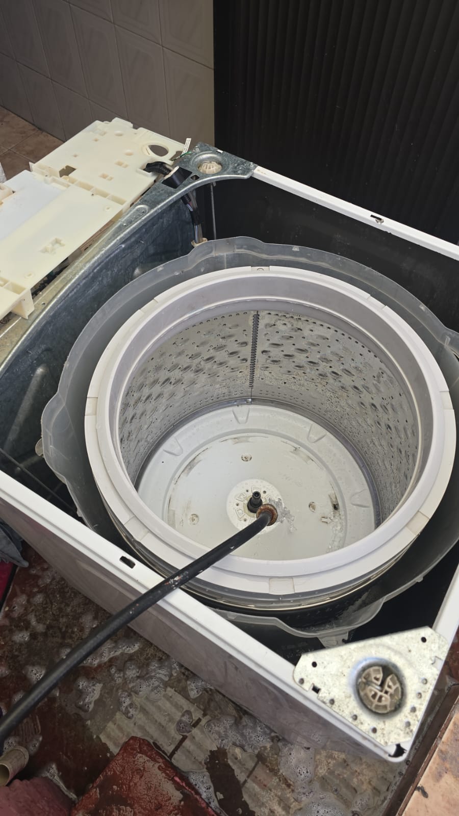 Reparación de tambor de lavadora de carga superior en servicio técnico a domicilio